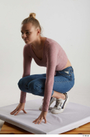  Kate Jones  1 blue jeans casual dressed kneeling pink long sleeve t shirt white sneakers whole body 0002.jpg